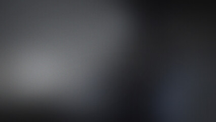 Dark gray and black grainy abstract texture background, with subtle gradient, and soft blurred, light spots © ico-vect