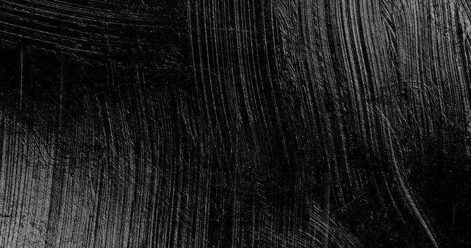 Black Paint Smear and Mix Stop Motion. Stop-motion sequence of thick glossy black paint being smeared, dragged and mixed across a dark surface.