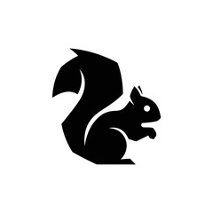 Black silhouette of a squirrel with a bushy tail and upright posture on plain white background © bentet