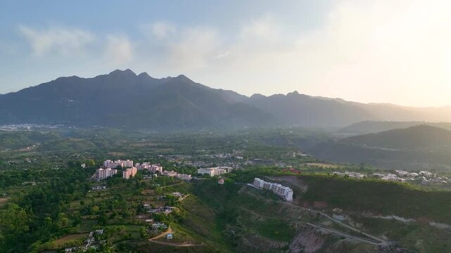 Cinematic Orbit drone flight over Katra Town and Vaishno Devi Trikuta hills.