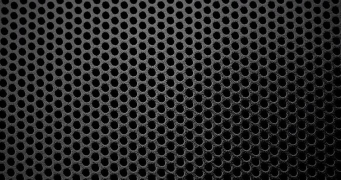 Perforated Metal Surface. Perforated Metal Surface. A black perforated surface with a repeating pattern of holes creates a textured, industrial look.	