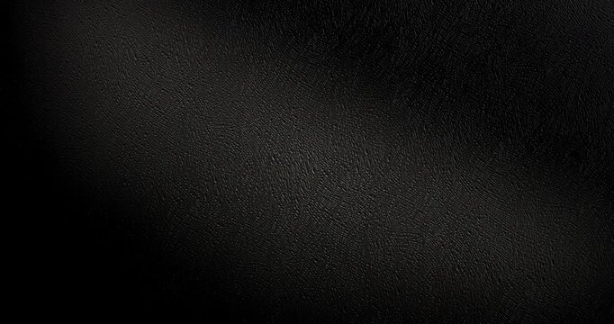 Slow Rotation Over Black Texture. Slow Rotation Over Black Texture. Smooth slow rotation across extreme close-up of fine black pebbled surface with dramatic side lighting.	