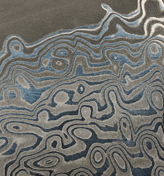 Macro surface of the Damascus steel blade with a unique wavy pattern