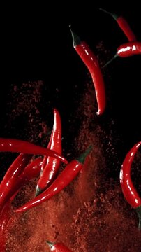 Red chili peppers fly up and fall down. Filmed on a high-speed camera at 1000 fps. High quality FullHD footage