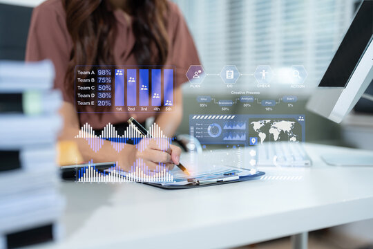 Business woman hand Project manager working and update tasks and Gantt chart scheduling virtual diagram.with smart phone, tablet and laptop in office.