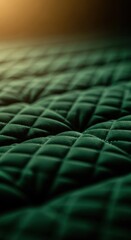 Naklejka premium Dark green quilted fabric texture, close-up, soft material, emerald quilt pattern