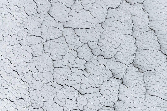 Aerial view of the cracked white surface and geometric patterns of the Uyuni Salt Flat, Potosi Department, Bolivia.