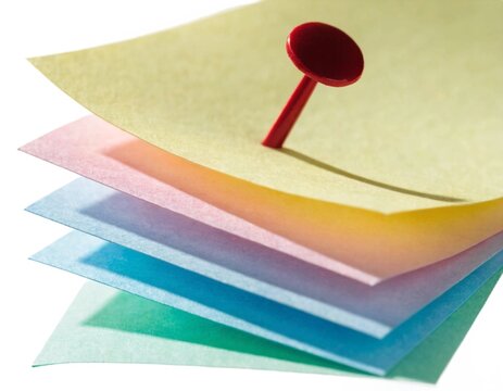 Stack of Pastel Sticky Notes with Red Push Pin Isolated on an isolated Background