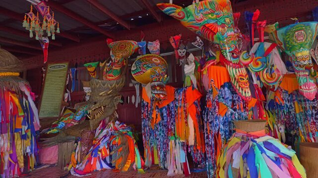 Loei, Thailand.24 December 2025: Colorful handmade Phi Ta Khon masks displayed at Wat Phon Chai Museum in Dan Sai, Thailand. Intricate designs and bold patterns highlight the region&rsquo;s unique folklore