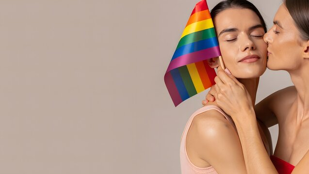 Two Women Embracing with Rainbow Flag Celebrating Love and Pride