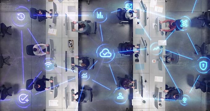 Top Down View of Tech Office With Diverse Multiethnic Workforce at Computer Desks as Linked Visualization Layer Appears, Glowing Blue Lines and Icons Depict Cloud Verification, Wifi and Security.