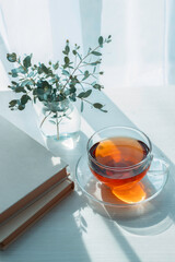 Morning tea with books and eucalyptus in natural sunlight © 清美 小池