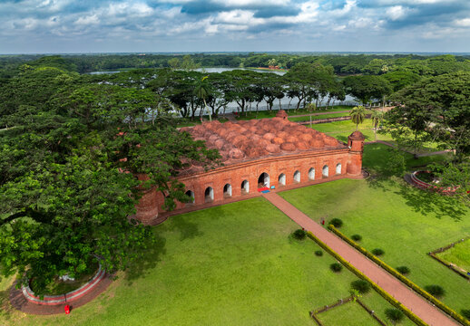 Aerial view of the historic Sixty Dome Mosque with its terracotta brick domes surrounded by lush green lawns and large trees Bagerhat, Khulna Division, Bangladesh.