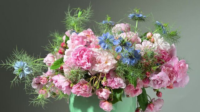 Floral arrangement with small pink roses, slow rotation