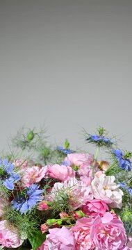 Floral arrangement with small pink roses, slow rotation