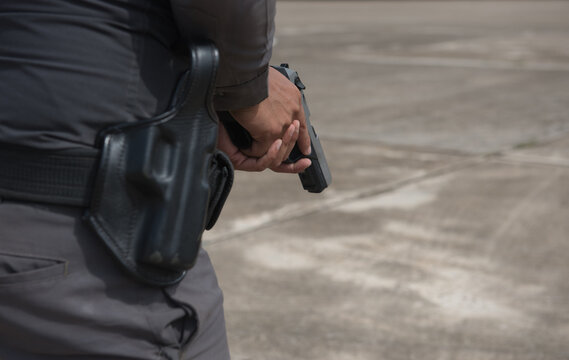 Police tactical firearms pistol training outdoors.	