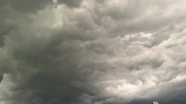 Dramatic dark storm clouds in sky before rain, powerful weather and climate concept with moody atmosphere and natural cloudscape outdoors