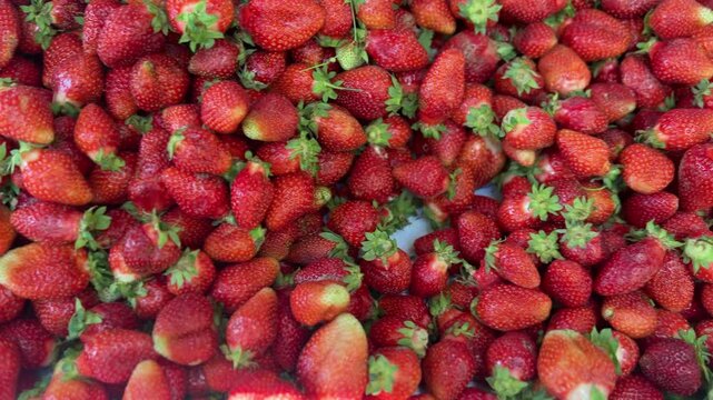 Fresh ripe strawberries background with vibrant red texture, healthy summer fruit and organic food concept with natural sweetness and colorful harvest aesthetic.