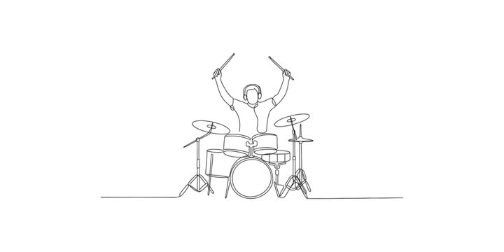 A man playing drums with enthusiasm and energy on a drum kit