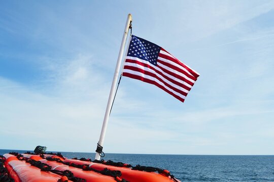 An American flag on a dingy boat. 