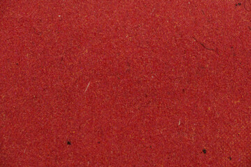 Fototapeta premium Red Recycled Paper Texture Background with Fibers Macro Close-Up