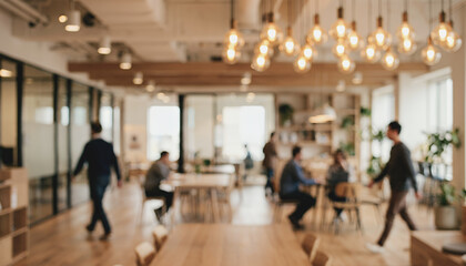 Fototapeta premium A blurred view of a modern office space with people working and interacting. A warm atmosphere is created by stylish light fixtures and wooden decor.