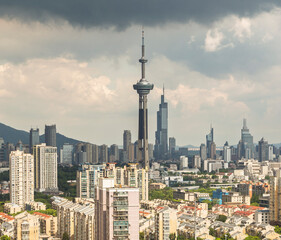 Naklejka premium Storm clouds over Nanjing skyline with modern towers and apartments