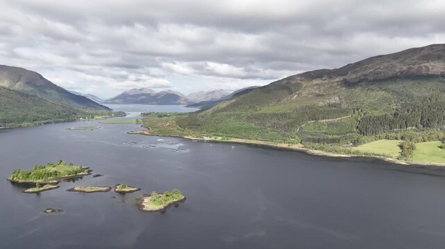 Sunny Spring Aerial Rise Over Loch Leven Looking Towards Glenachulish with Pan Down to the Distant Horizon