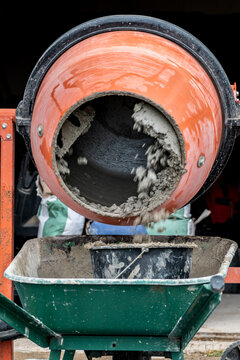 Concrete mixer mixing cement, sand and water to produce concrete