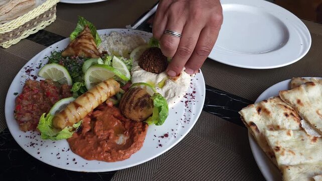 Middle Eastern appetizer platter with hummus, baba ghanoush and traditional mezze selection