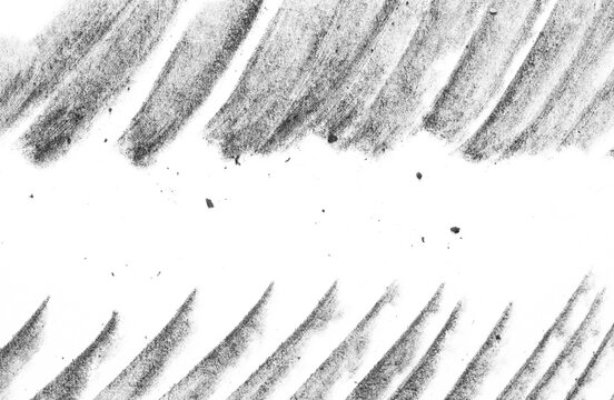 Macro charcoal texture with bold diagonal brush strokes framing a wide central copy space, isolated on a transparent background for overlay, text placement, and design use.