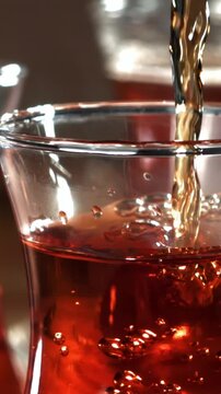 Turkish tea is poured into a glass. Filmed on a high-speed camera at 1000 fps. High quality FullHD footage