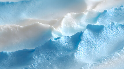 Fototapeta premium Close up macro photograph of soft cosmetic cream texture showing swirls of white and blue colors in a smooth pattern
