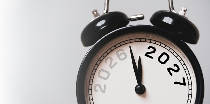 New year countdown and time management concept with black alarm clock transition change from 2026 to 2027 Symbol of deadline, business planning, urgency, target achievement and future goals.