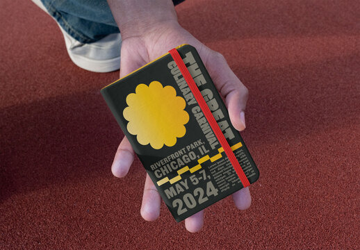 Mockup of a Blank Notebook cover Held in a Hand