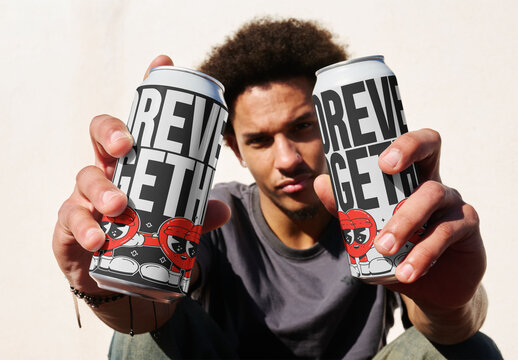 Man Holds Tall Boy Cans in a Mockup Setting