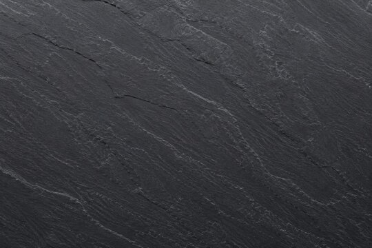 Natural dark grey slate stone texture.