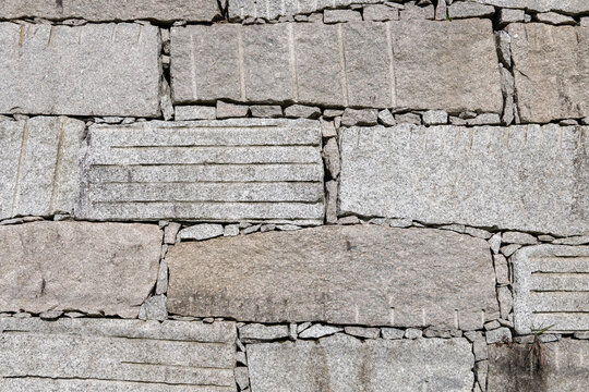 Background of a granite ashlar wall with dry stone construction technique