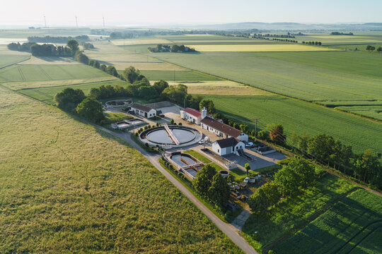  Aerial view of modern industrial sewage treatment plant at sunset.