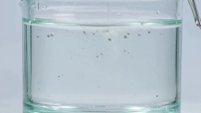 Glass jar with water and bubbles