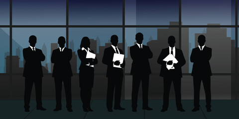 Silhouettes of business professionals standing in front of a city skyline at dusk © MdMosahid