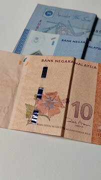 Close-up of Malaysian 1 Ringgit and 10 Ringgit banknotes