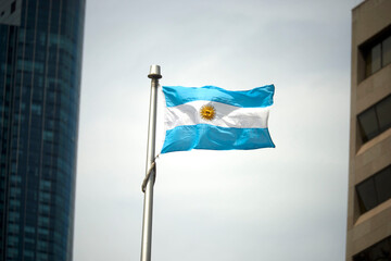 Fototapeta premium The Argentinian flag on a flag pole at Toronto City Hall’s Nathan Phillips Square.