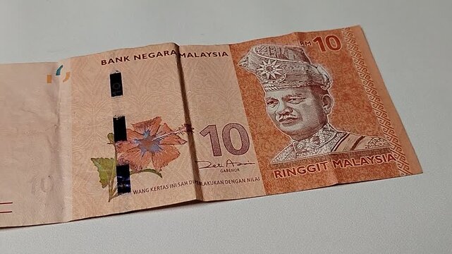 Closeup of 10 Malaysian Ringgit banknote featuring detailed currency texture and financial concept. Perfect for economy, banking, investment, inflation, and Southeast Asian money themes.
