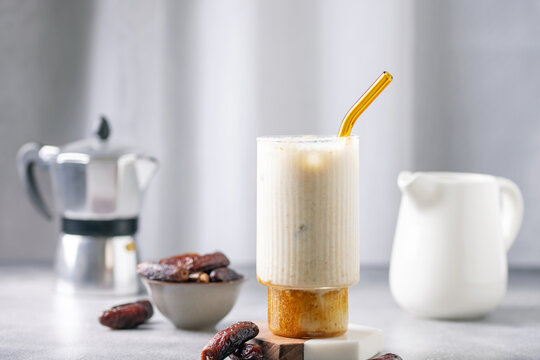 Iced dates latte cup. Alternative trendy vegan drink