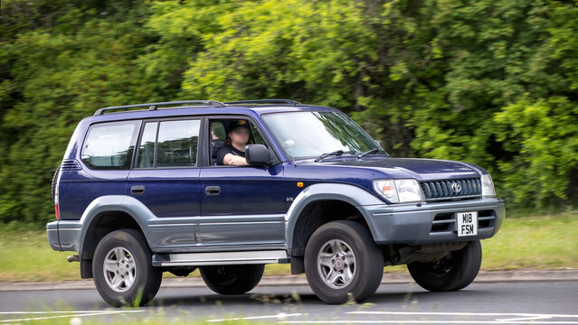 Milton Keynes,Bucks,UK - May 21st 2026:  1998 Toyota Landcruiser SUV  classic car driving on a British road