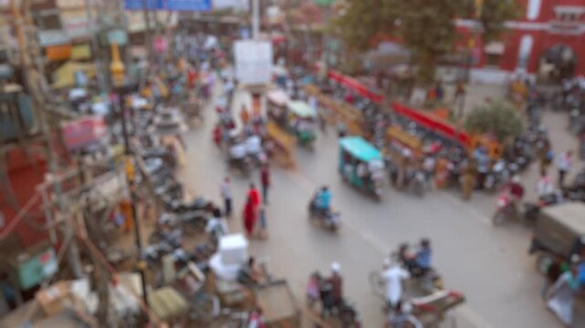 Bokeh view of road traffic on the crowded streets of Varanasi, India. Blurred background footage.