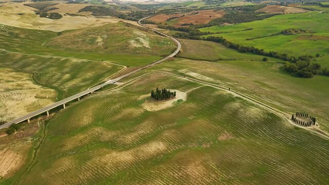 Val dOrcia rolling green hills landscape with famous cypress grove circle drone flight panoramic valley view of traditional tuscan countryside tuscany italy travel stock video