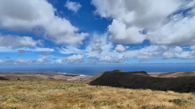 Lanzarote time-lapse from Mirador Barranco del Chafar&iacute;s viewpoint with fast-moving clouds over imposing landscapes, dramatic skies and cinematic Canary Islands scenery.