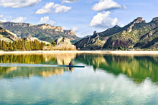 Man kayaking on the reservoir in the Sant Lloren&ccedil; de Montgai Natural Park, Noguera region, Lleida, Catalonia. Nature, water sports